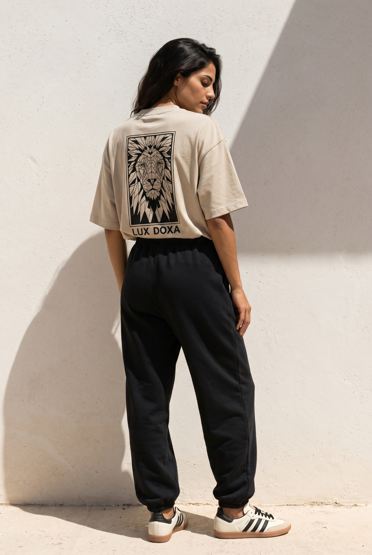 TAV Edition 001 — model wearing oversized hoodie and trousers